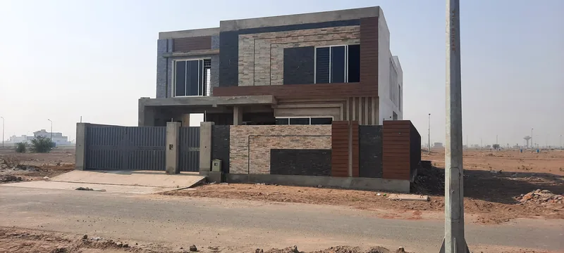 House 469 Sector Q DHA Multan front elevation with stone cladding and main gate 2020