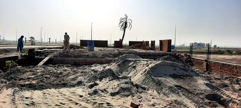House 126 Sector R DHA Multan brickwork in progress with sand stock at site